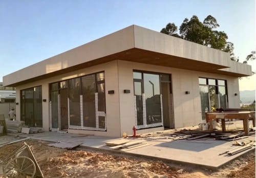 Hengyuan WPC wall panels applied to the exterior eaves and corridor ceilings of modern architecture, showcasing superior flatness and refined texture.
